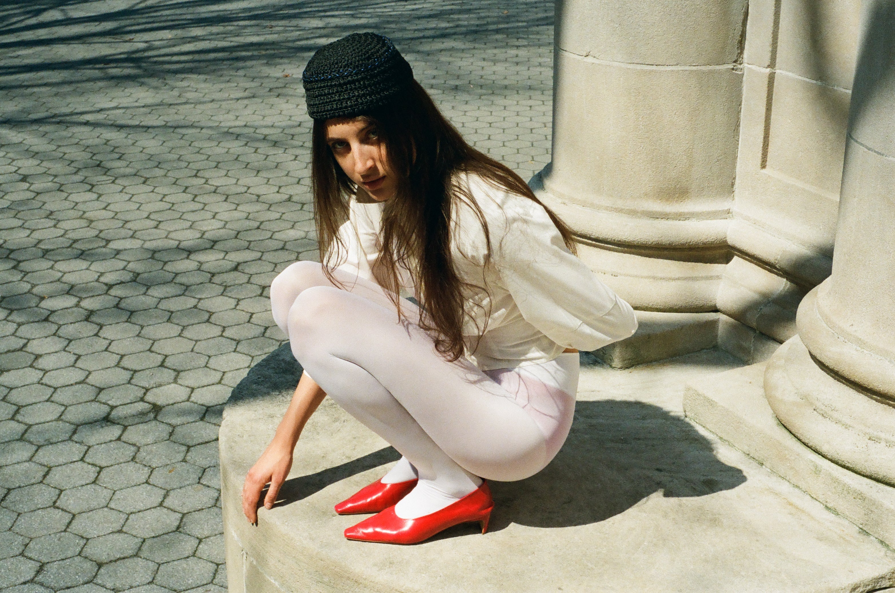Woman wearing Dyan Pump in fiamma red leather – editorial shoot – KATT FORE