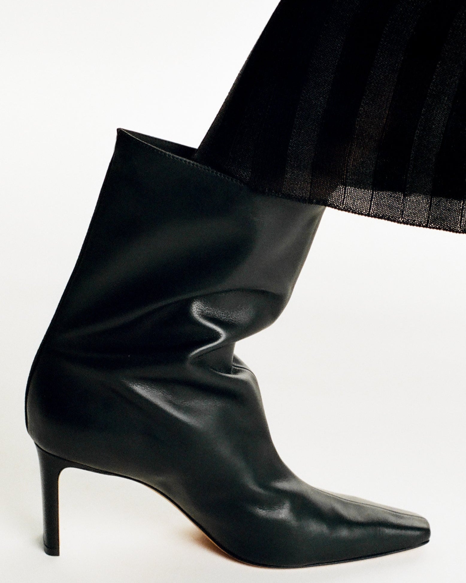 Woman wearing Olympe Mid Cut black leather boots – editorial shoot – KATT FORE